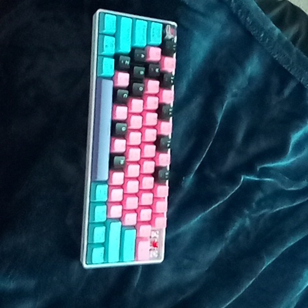 Here we have a pink and black Superman keyboard gs63 wired mechanical keyboard